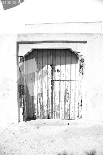 Image of blue door in antique village santorini greece europe and    whit