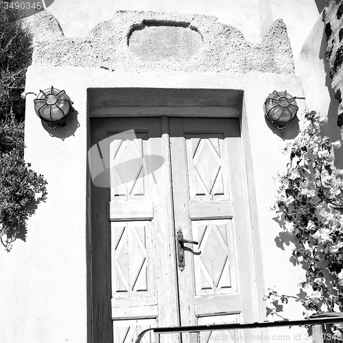 Image of blue door in antique village santorini greece europe and    whit