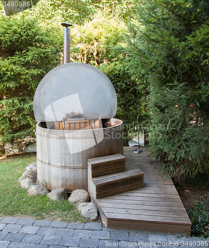 Image of Wooden hot tub in the alps