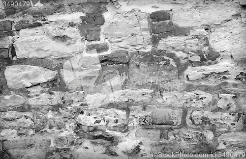 Image of old brick wall with cracked stucco layer background