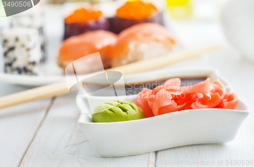 Image of ginger, vasabi and soy sauce in white bowl