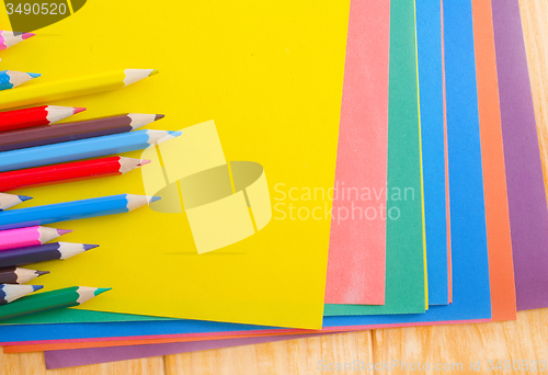 Image of color paper and pencils