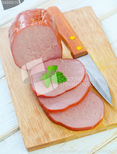 Image of Ham on wooden board