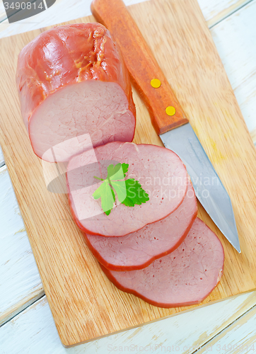 Image of Ham on wooden board