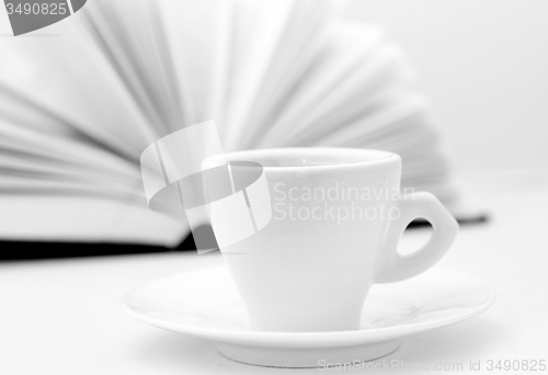 Image of coffee and open book