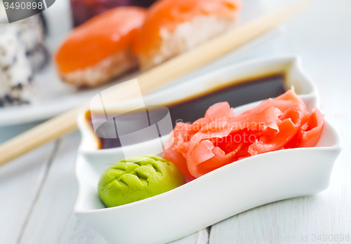 Image of ginger, vasabi and soy sauce in white bowl