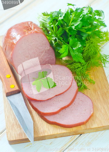 Image of Ham on wooden board