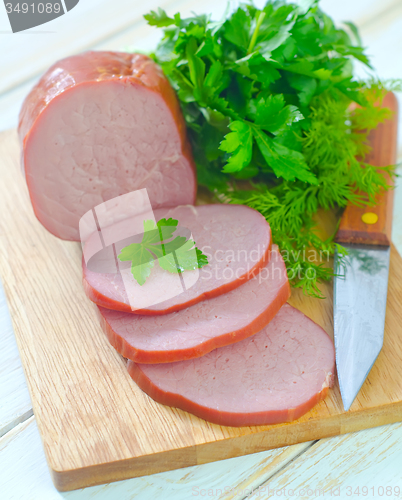 Image of Ham on wooden board