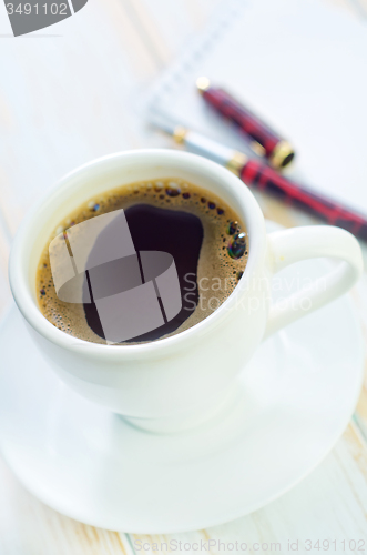 Image of coffee and note