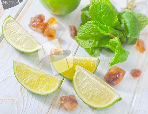 Image of lime with mint and sugar