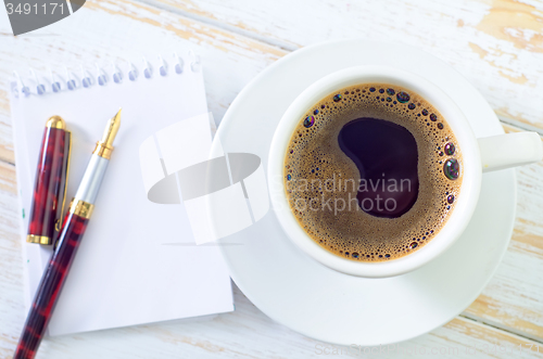 Image of coffee and note