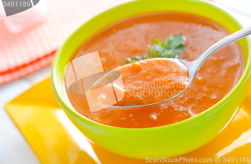 Image of Fresh soup from pumpkin in the green bowl