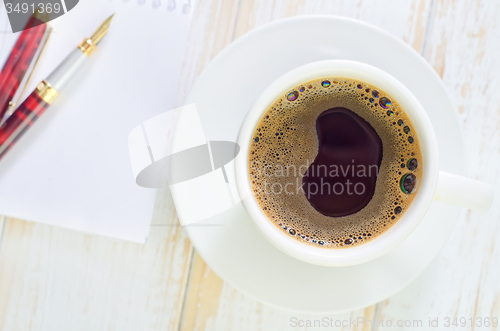 Image of coffee and note