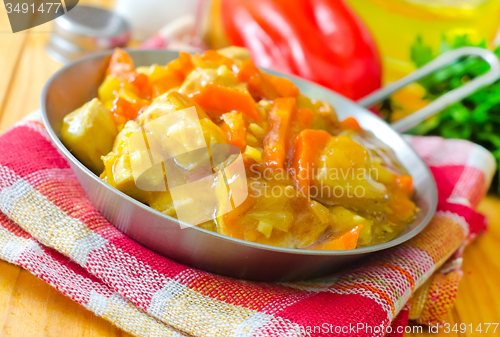 Image of chicken with vegetable in metal plate