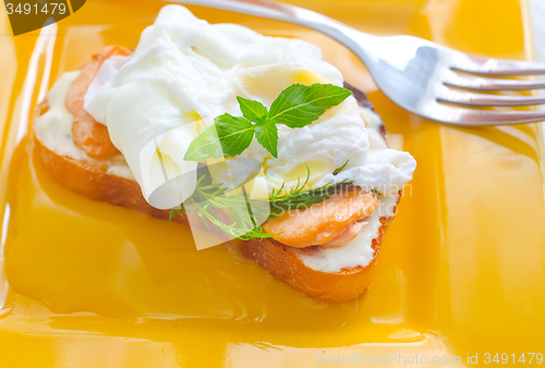 Image of Close Up of Poached Delicious Egg with Whole Grain Bread