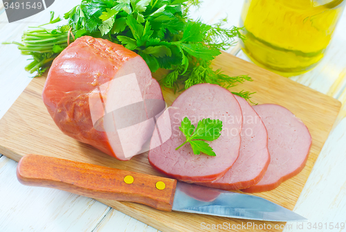 Image of Ham on wooden board