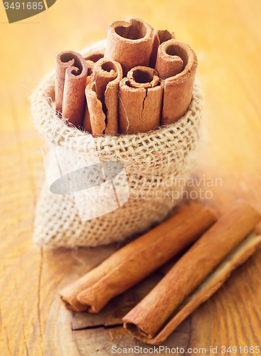 Image of Aroma cinnamon sticks on the wooden board