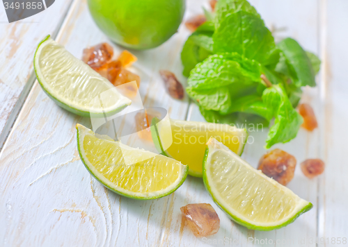 Image of lime with mint and sugar