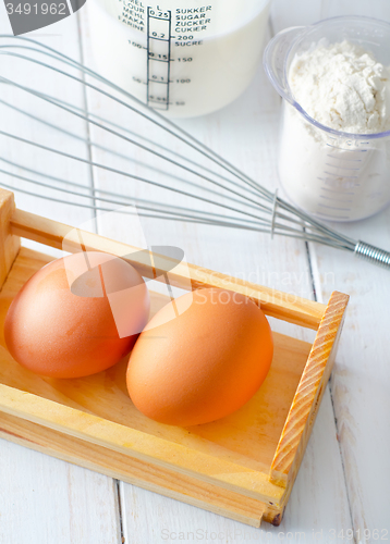 Image of ingredients for dough, eggs, flour and milk