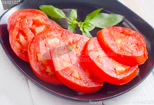 Image of Fresh tomato with green aroma basil