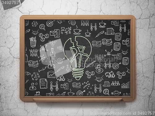 Image of Business concept: Light Bulb on School Board background