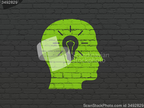 Image of Finance concept: Head With Light Bulb on wall background