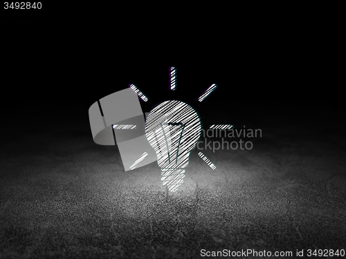 Image of Finance concept: Light Bulb in grunge dark room