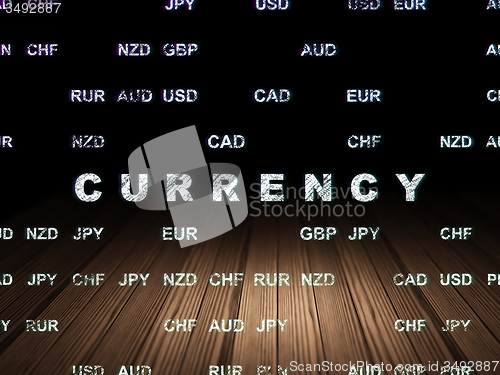 Image of Money concept: Currency in grunge dark room