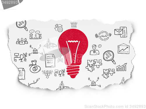 Image of Business concept: Light Bulb on Torn Paper background