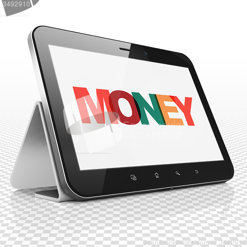 Image of Currency concept: Tablet Computer with Money on  display