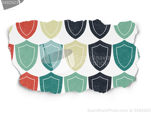Image of Safety concept: Shield icons on Torn Paper background