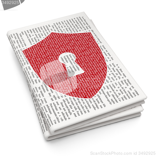 Image of Security concept: Shield With Keyhole on Newspaper background