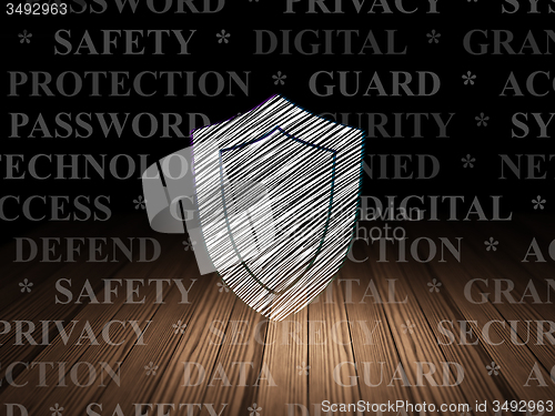 Image of Privacy concept: Shield in grunge dark room