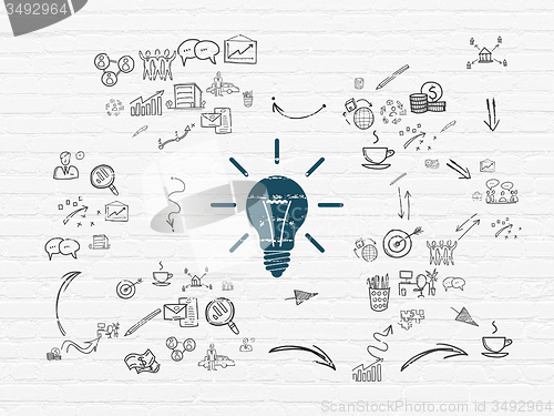 Image of Business concept: Light Bulb on wall background