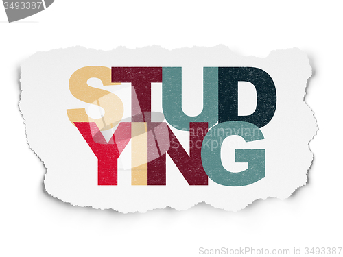 Image of Education concept: Studying on Torn Paper background