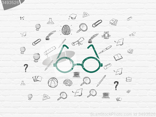 Image of Studying concept: Glasses on wall background
