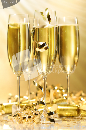 Image of Glasses of golden champagne