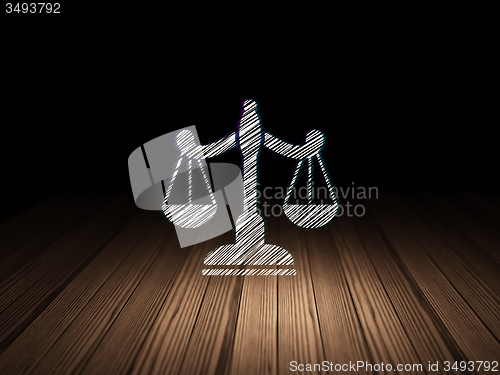 Image of Law concept: Scales in grunge dark room