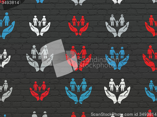 Image of Insurance concept: Family And Palm icons on wall background