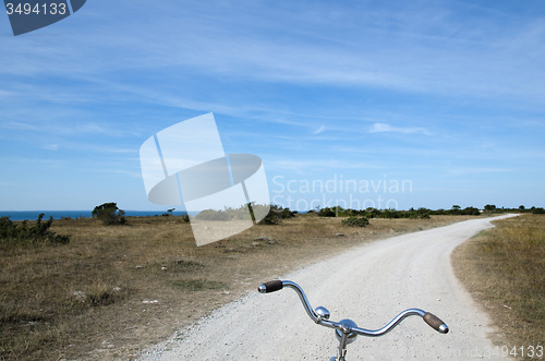 Image of Biking on a gravel road