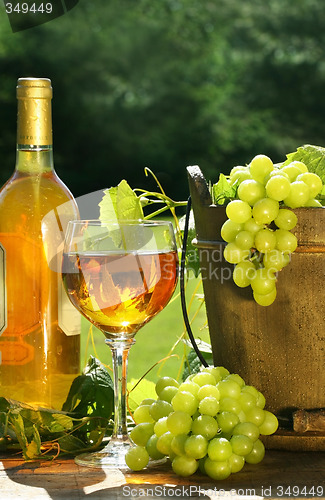 Image of White wine with bottle and grapes