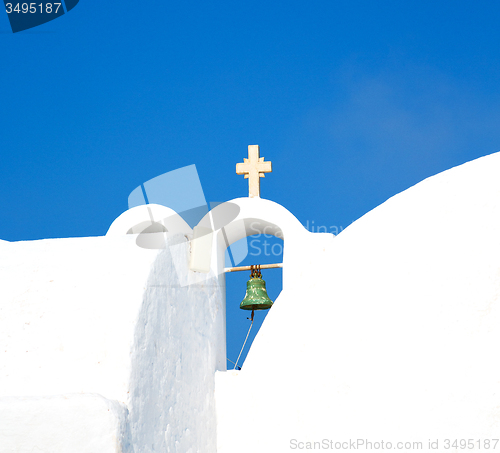 Image of cross  in santorini greece old construction and the sky