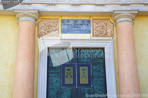 Image of  church door   in italy  lombardy   column  the milano  pink cop