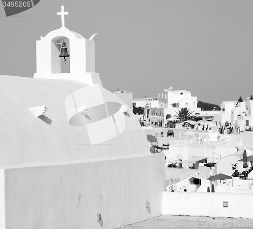Image of cross  in santorini greece old construction and the sky