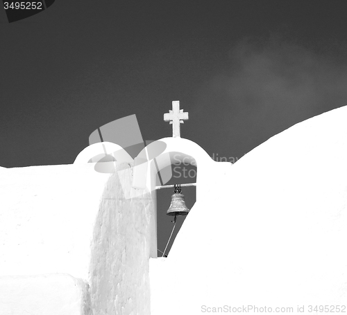 Image of cross  in santorini greece old construction and the sky