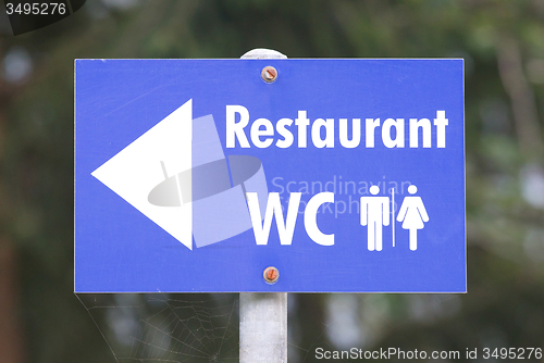 Image of Sign for a restaurant and toilets