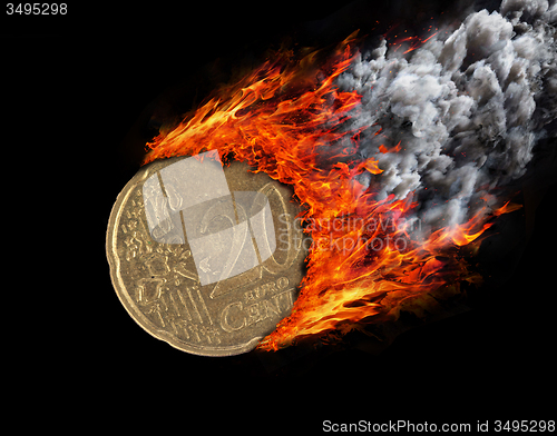 Image of Burning coin with a trail of fire and smoke