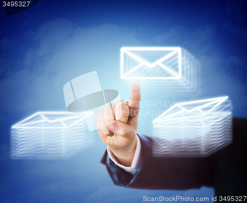 Image of Hand Moving Email Between Two Document Stacks