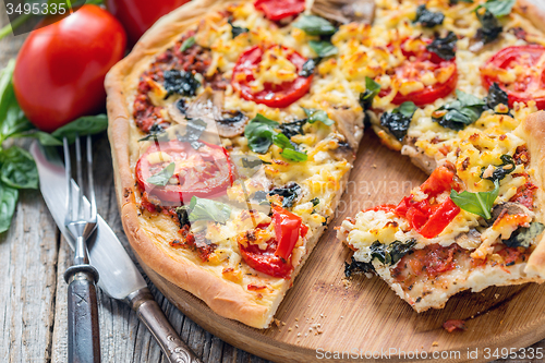 Image of Pizza with mushrooms and cheese close up.