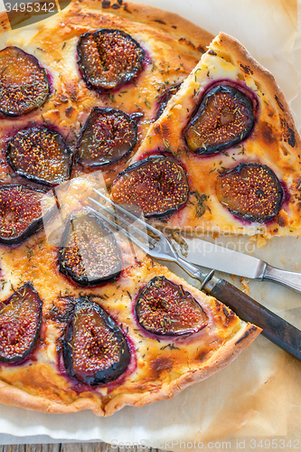 Image of Pizza with figs and thyme. Top view.